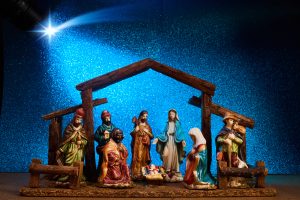 Christmas Manger scene with figurines including Jesus, Mary, Joseph.